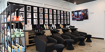 Hair wash stations with hair product displayed nearby